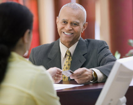 Woman paying for a transaction with a card.